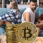 couple sitting on couch with backs to each other, concept of Impact of Cryptocurrency on Child Support Calculations in NJ