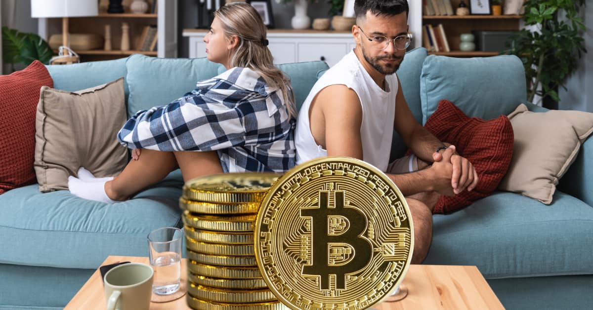 couple sitting on couch with backs to each other, concept of Impact of Cryptocurrency on Child Support Calculations in NJ