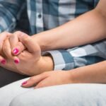 couple holding hands, concept of How Remarriage Can Affect Divorce Settlements in NJ