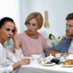 man and woman with unhappy in-law, concept of how to handle in-laws during divorce