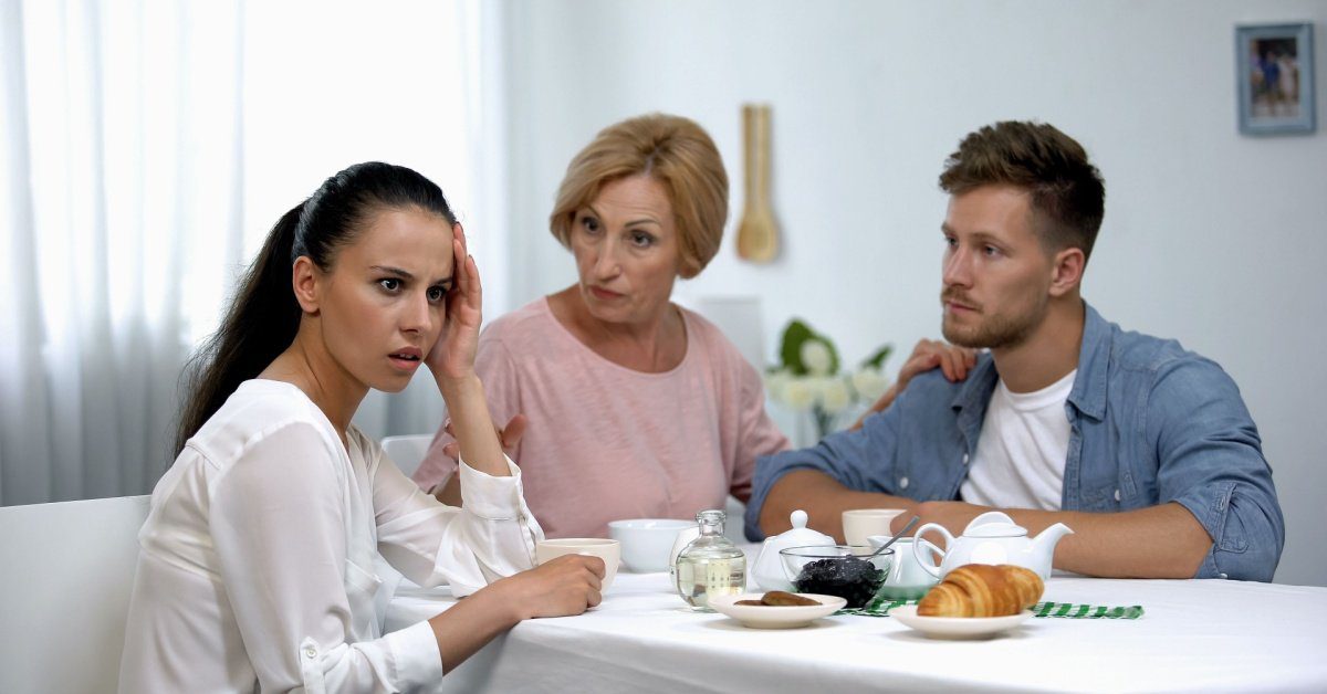 man and woman with unhappy in-law, concept of how to handle in-laws during divorce