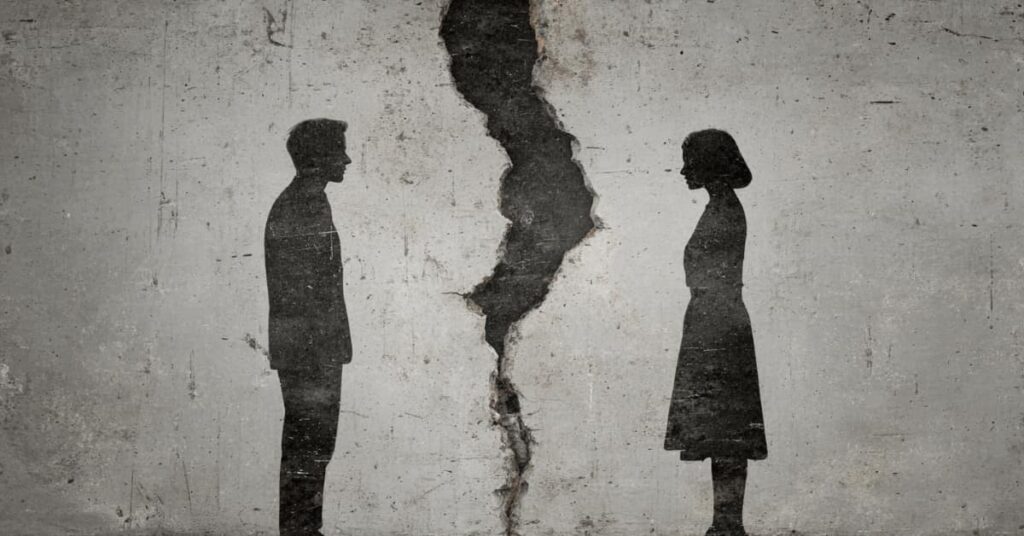 silhouette of male and femal with break, crack between them, concept of Legal Separation vs. Divorce