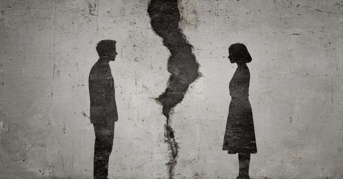 silhouette of male and femal with break, crack between them, concept of Legal Separation vs. Divorce
